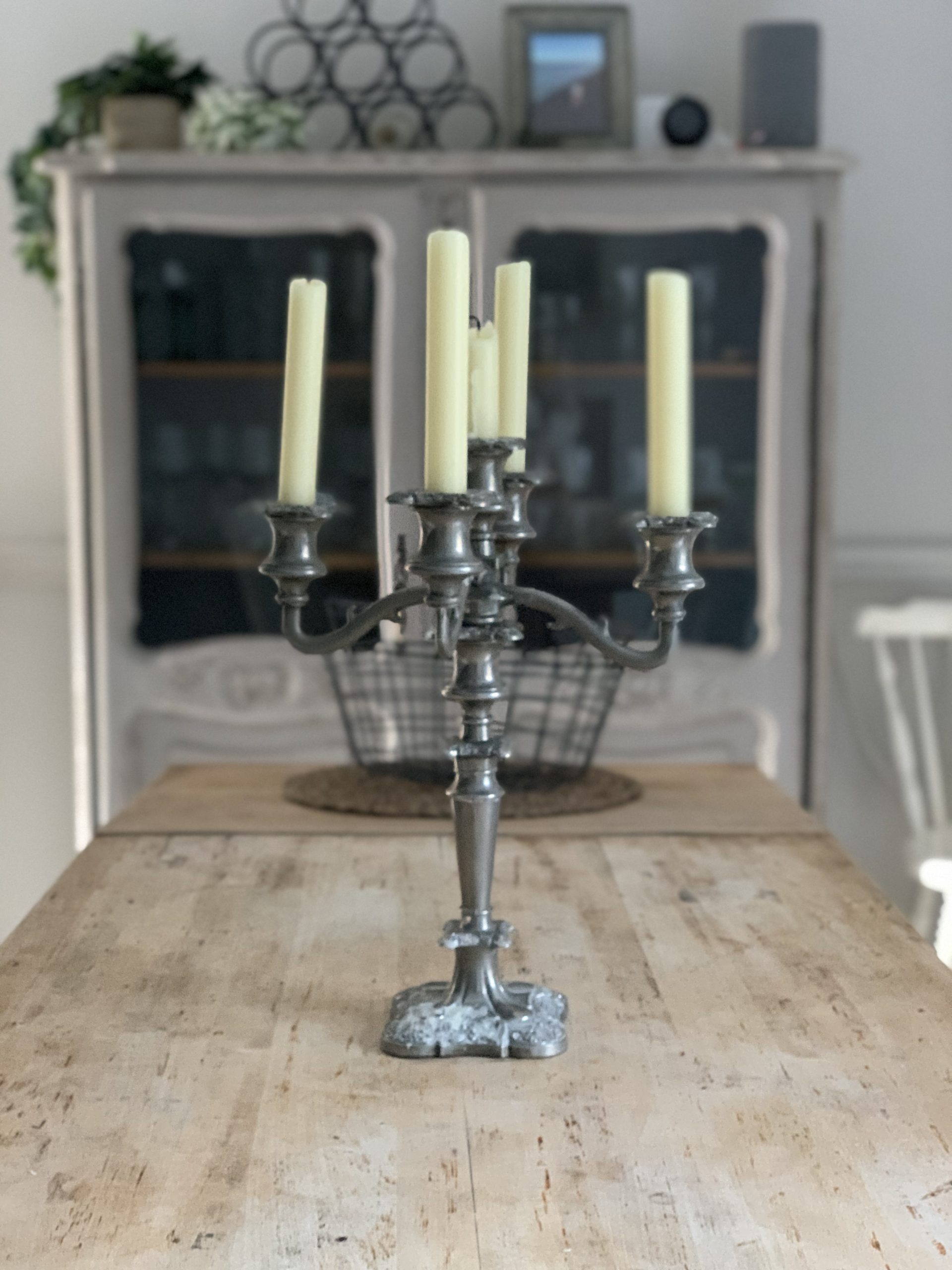A silver candelabra on a wooden dining table at The House in Deal holiday cottage