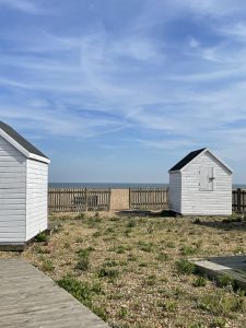 Picture of two white beach huts on Deal beach in Deal Kent, shot taken by The House in Deal a holiday cottage to rent in Deal, Kent