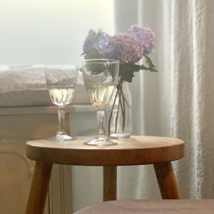 Picture of 2 old fashioned wine glasses on a small table in the sitting room in The House in Deal, holiday cottage to rent in Deal Kent
