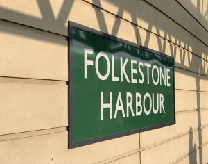 picture of a green sign with white writing which says Folkestone Harbour picture used on the house in deal website 