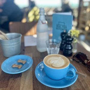 pictufe of a blue coffee cup, on a wooden table in deal kent